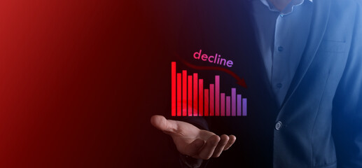 Business man holding holographic graphs and stock.Decline, decrease, down, drop. Business statistic. Career, money, success concept. Regression, crisis.Business and financial crisis concept