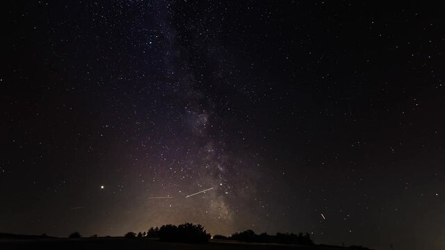 Time lapse milky way with planes in the night sky