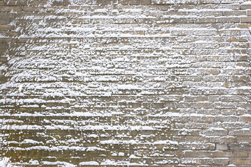 Stunning textured effect on the wall of a house, caused by blowing snow during a blizzard