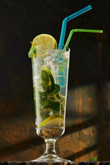 Cocktails in glassware on stone background