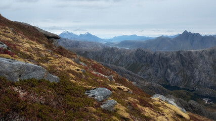 Fototapeta na wymiar Mountain .ridge above the town of Nusfjord in the Lofoten Islands, during a golden autumn