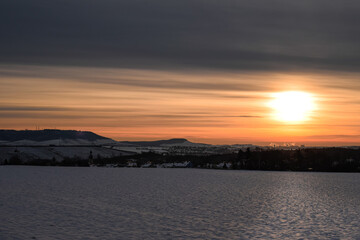 Naklejka premium sunrise over the Snow field 