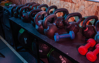 Rack with kettlebell in red-blue neon light