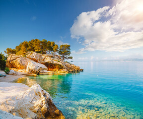 Cozy and wild beach with azure water in luxurious lagoon. Location place Croatia, Dalmatia region,...