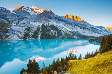 Idyllic panorama view of the lake Oeschinensee. Location place Swiss alps, Kandersteg, Europe.