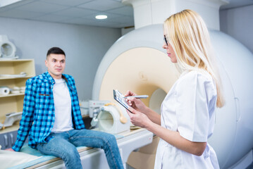 Male patient talking to doctor before mri scan