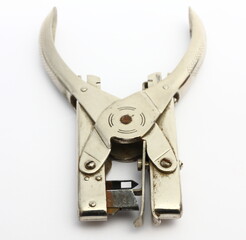 old paper stapler over white, front view