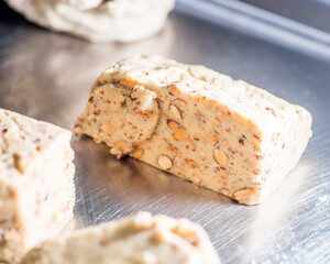 Light dough with nuts, seeds and almonds. Sweet toffee with nuts