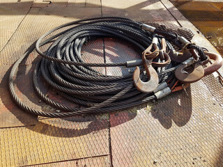 Chain hook of the tower crane for lifting cargo close-up. Rope slings close-up