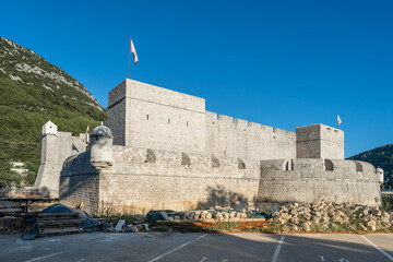 Ston fortress Fort Kastio in sunset hour in ancient town Ston in Ragusa Croatia