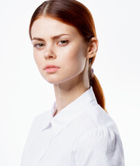 red-haired woman in white shirt gesturing with hand emotions studio cropped view