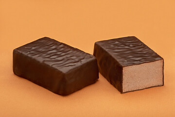 Chocolate candy on a colored background