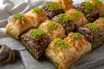 Turkish Ramadan Dessert Baklava from pistachios and walnuts. Selective focus.