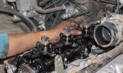 Fototapeta premium The mechanic is checking the engine.
