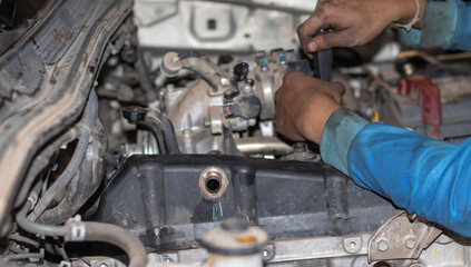 Fototapeta premium The mechanic is checking the engine.