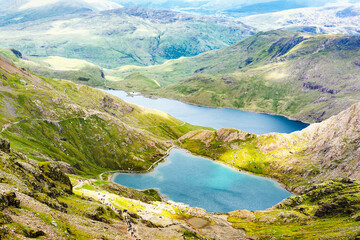 View of beautiful double lakes in North Wales, Snowdonia National Park, mountains on the back, selective focus