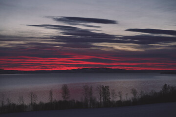 Fototapeta premium Helgøya Island in Lake Mjøsa at winter by sunrise.
