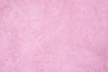 Pink stucco wall background. Pink painted cement wall texture