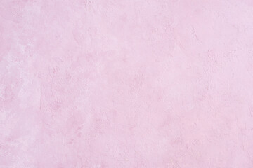Fototapeta premium Pink stucco wall background. Pink painted cement wall texture