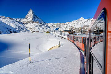 Taking a train from Zermatt to a peak Gornergrat. Matterhorn in the background.