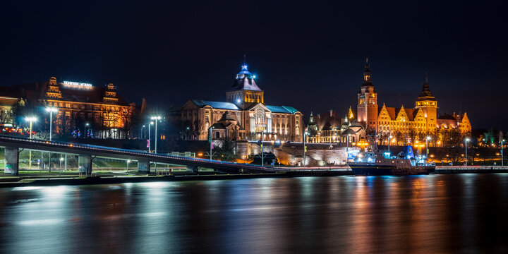 urban waterfront with old buildings at night
