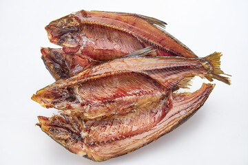 Dried salted fish on a white background