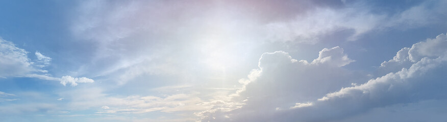 Naklejka na ściany i meble White clouds and morning sun on blue sky panoramic background