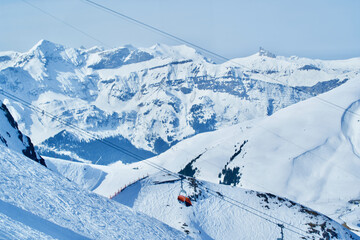 Fototapeta na wymiar Snow mountains panorama with chair lift in the center at Grindelwald, Switzerland.