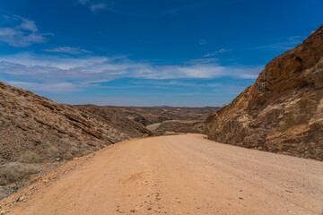 Landscape with road at Namib-Naukluft National Park , s a national park of Namibia, background blue sky