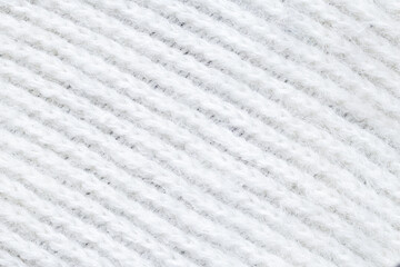 Fototapeta na wymiar Knitted loops background. Knitted texture. White Knitted Fabric Texture. White knitting wool texture background. Wool sweater texture close up.