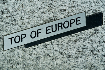 Top of Europe Logo at stone bench at Jungfraujoch. Photo taken February 27th, 2021, Jungfraujoch, Switzerland.