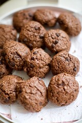 Organic homemade chips cookies with chocolate and cocoa. Close up and blurry view.