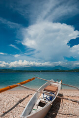 Outrigger fishing boat under a sunny afternoon