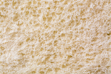 Close up shot of a bread background texture. Macro bread slice texture pattern