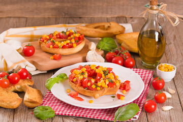 Friselle with tomatoes and mais. 