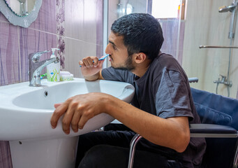 Muslim young man with special needs is trying to depend on himse