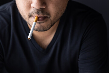 Young men are going to smoke He put a cigarette in his mouth. World No Tobacco Day.