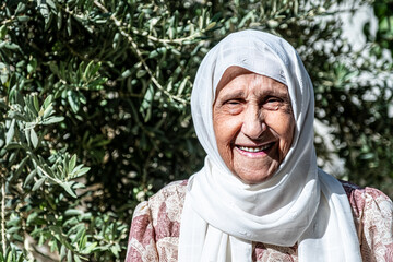 Happy old woman in the garden