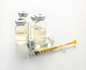 syringe and medicine bottle