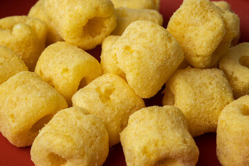 Crispy Corn rings salty snacks. Fast food or junk food snacks unhealthy concept.