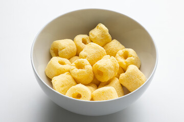 Crispy Corn rings salty snacks. Fast food or junk food snacks unhealthy concept.