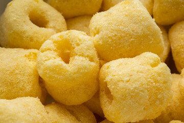 Crispy Corn rings salty snacks. Fast food or junk food snacks unhealthy concept.