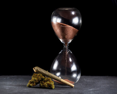 Hourglass with cannabis joint time to smoke