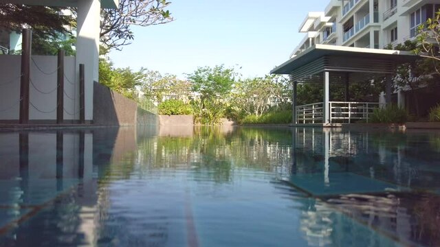Close up swimming pool and blur background condominium, comfortable and luxury concept.