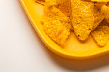 Crispy mexican nachos chips salty.Snacks Fast food or junk food snacks unhealthy concept.