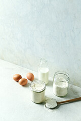 Wheat flour, coconut flour, eggs and milk for cake making. Homemade food concept