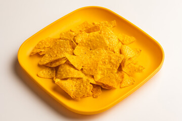 Crispy mexican nachos chips salty.Snacks Fast food or junk food snacks unhealthy concept.