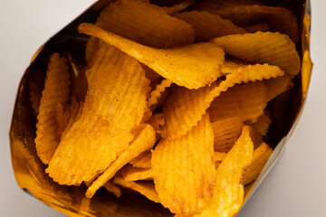 Crispy Potato chips snacks in bag package. Fast food or junk food snacks unhealthy concept.