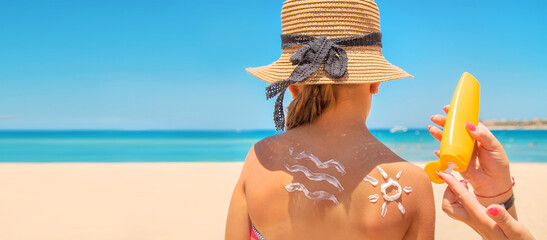 Sunscreen on the skin of a child. Selective focus.