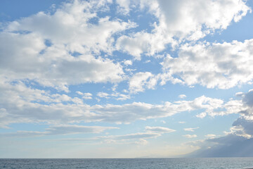 Beautiful blue sky and clouds, mountains and sea